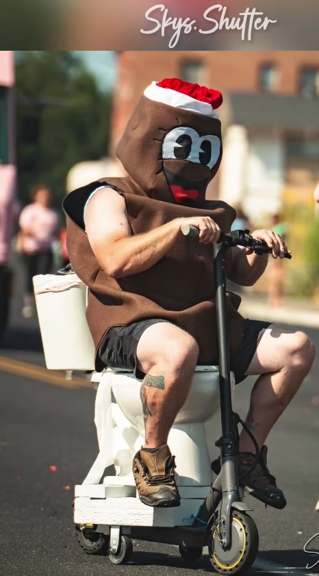Close-up of Dookie Septic's Mr. Hankey-inspired toilet-scooter costume at the 2025 Yakima SunFair Parade