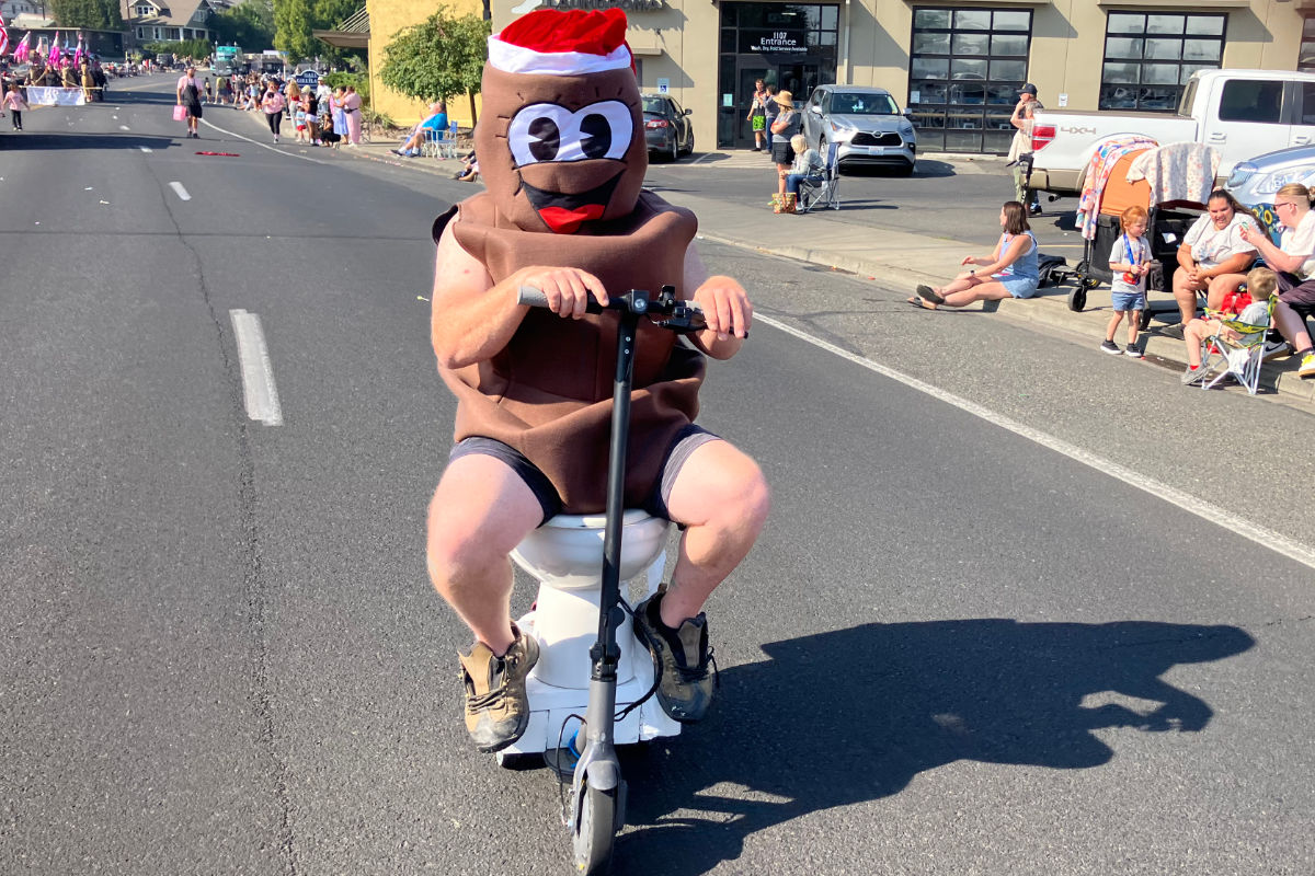 Dookie Septic's toilet-scooter float riding the 2025 Yakima SunFair Parade route
